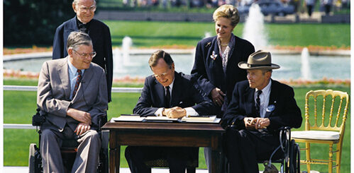 President Bush signs ADA.