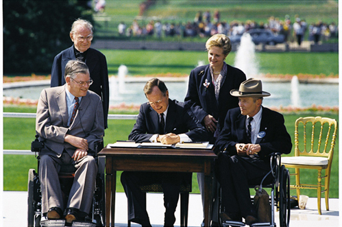 President Bush signs ADA.